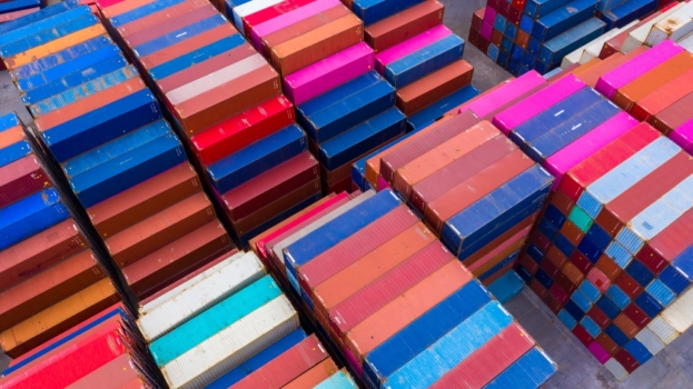 an aerial view of very colorful shipping containers stacked together