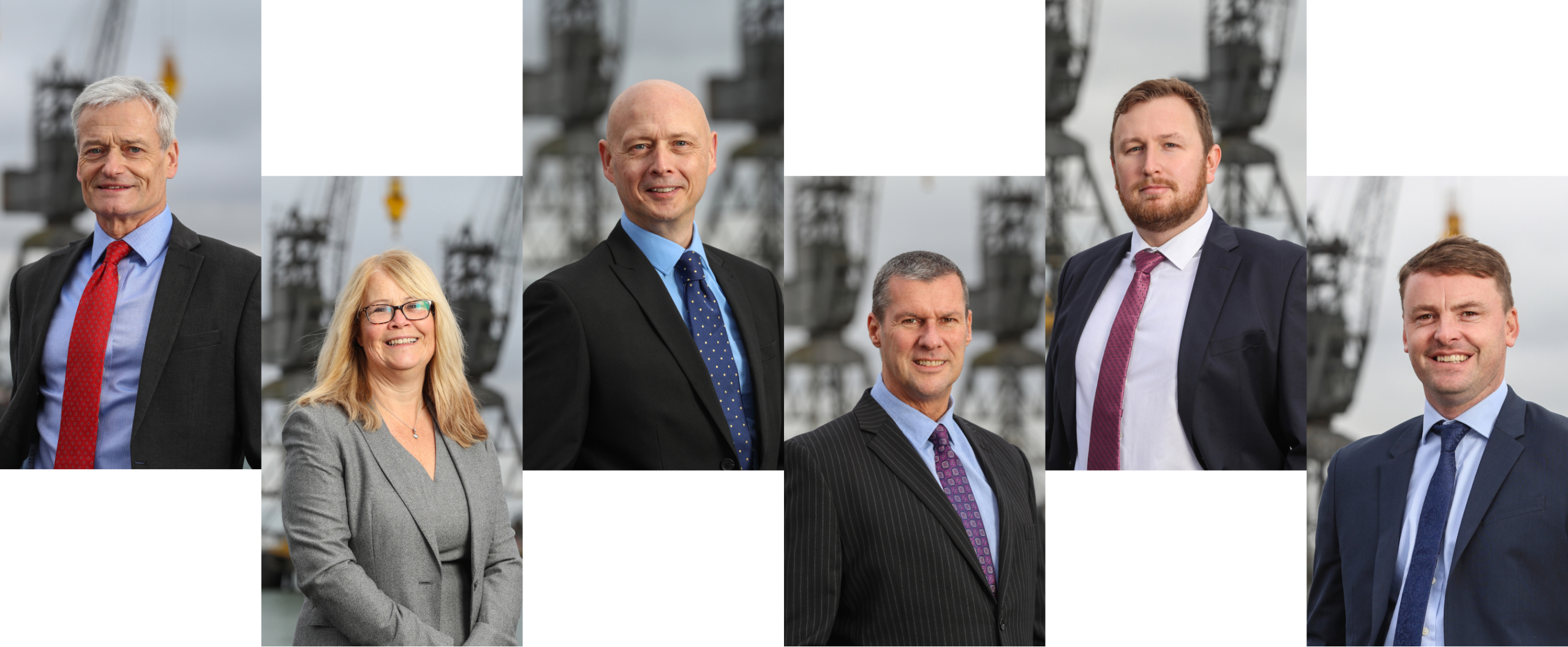 members of our management team smiling at the camera